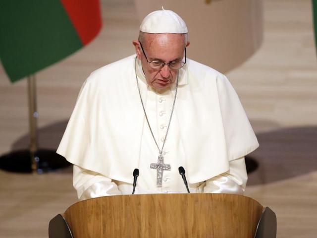 Pope Francis attends a meeting with the Baku Muslim sheikh and representatives of all the major faiths in Baku's main mosque in Azerbaijan on Sunday. (AP) Pope Francis attends a meeting with the Baku Muslim sheikh and representatives of all the major faiths in Baku's main mosque in Azerbaijan on Sunday. (AP)