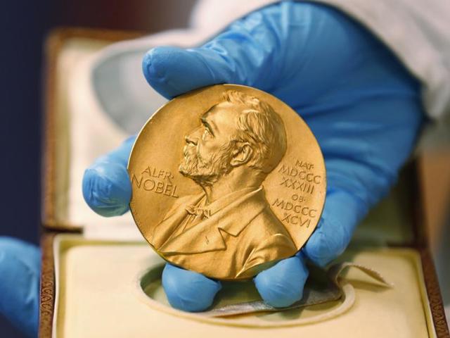 A national library employee shows the gold Nobel Prize medal awarded to the late novelist Gabriel Garcia Marquez, in Bogota, Colombia. (AP File Photo) A national library employee shows the gold Nobel Prize medal awarded to the late novelist Gabriel Garcia Marquez, in Bogota, Colombia. (AP File Photo)