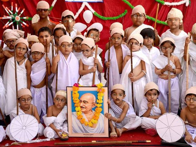 Children in Ajmer dress up as Mahatma Gandhi to mark the Father of the Nation’s 147th birth anniversary on Saturday. (PTI Photo) Children in Ajmer dress up as Mahatma Gandhi to mark the Father of the Nation’s 147th birth anniversary on Saturday. (PTI Photo)