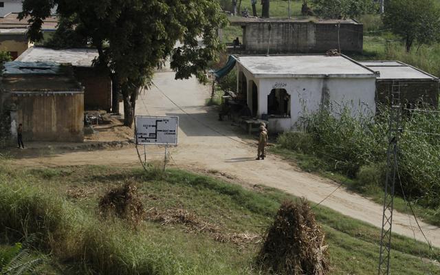A Pakistani soldier stands guard at checkpoint in Bagsar village close to the Line of Control (LOC). (AP Photo) A Pakistani soldier stands guard at checkpoint in Bagsar village close to the Line of Control (LOC). (AP Photo)