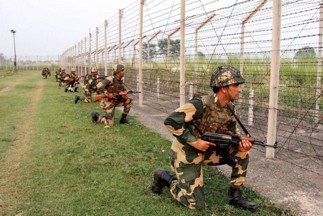 India’s BSF personnel keep tight vigil at the India and Pakistan International Border, at Gakhrial of Akhnoor sector in Jammu and Kashmir. (PTI Photo) India’s BSF personnel keep tight vigil at the India and Pakistan International Border, at Gakhrial of Akhnoor sector in Jammu and Kashmir. (PTI Photo)