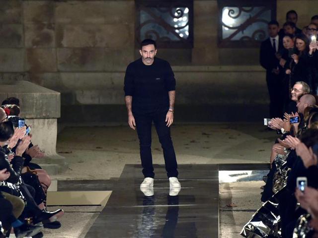 Fashion designer Riccardo Tisci acknowledges the audience at the end of the show. (AFP)