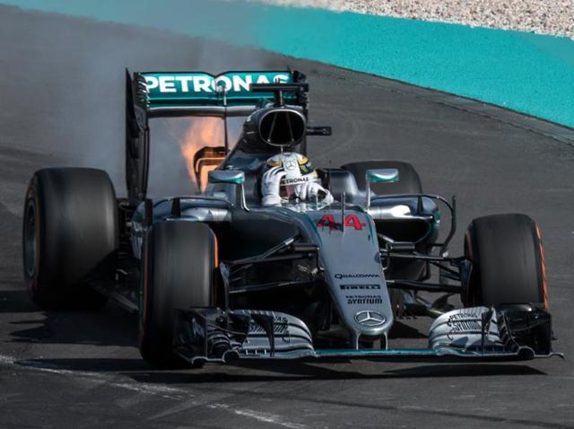 Mercedes AMG Petronas F1 Team's British driver Lewis Hamilton reacts as his car is engulfed in flames. (AFP Photo) Mercedes AMG Petronas F1 Team's British driver Lewis Hamilton reacts as his car is engulfed in flames. (AFP Photo)