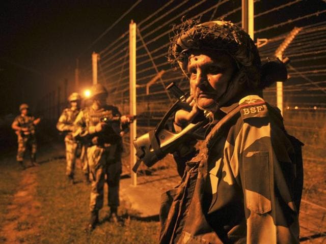 Border Security Force (BSF) soldiers standing guard during a night patrol near the fence at the India-Pakistan International Border at the outpost of Akhnoor sector, about 40 km from Jammu, on Sunday, October 02, 2016. (Nitin Kanotara / HT Photo) Border Security Force (BSF) soldiers standing guard during a night patrol near the fence at the India-Pakistan International Border at the outpost of Akhnoor sector, about 40 km from Jammu, on Sunday, October 02, 2016. (Nitin Kanotara / HT Photo)