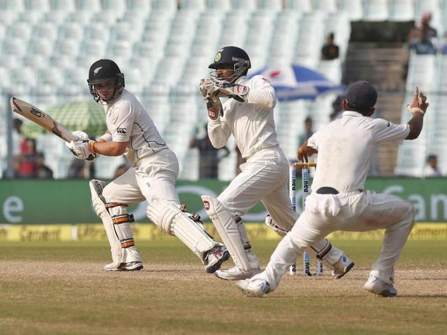 India's wicketkeeper Wriddhiman Saha (C) takes a catch to dismiss New Zealand's Tom Latham. (REUTERS)
