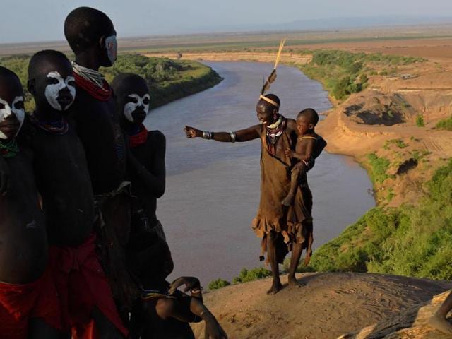 Members of the Karo tribe pose in front of the Omo river on September 23, 2016. (AFP) Members of the Karo tribe pose in front of the Omo river on September 23, 2016. (AFP)