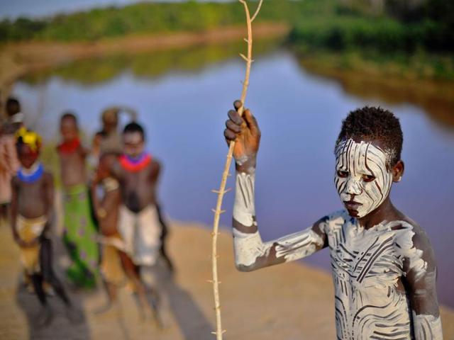 A boy from the Karo tribe poses for a photo in front of the Omo river on September 23, 2016. (AFP) A boy from the Karo tribe poses for a photo in front of the Omo river on September 23, 2016. (AFP)