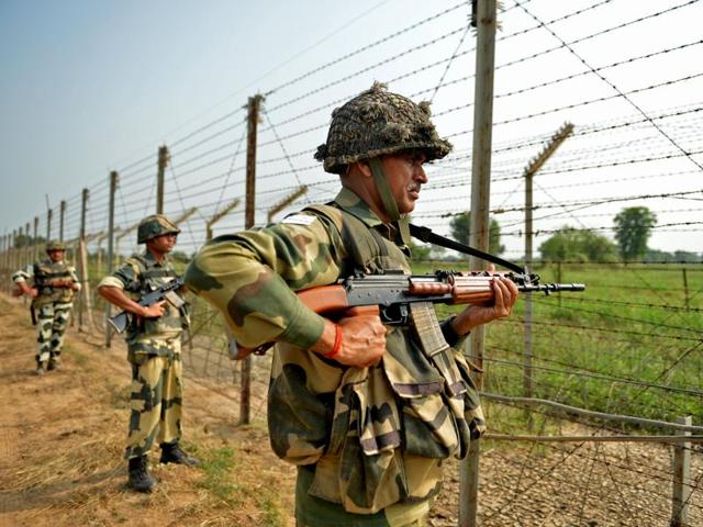 Border Security Force (BSF) soldiers take up positions at an outpost along a fence at the India-Pakistan border in RS Pora south-west of Jammu on October 2, 2016. (AFP) Border Security Force (BSF) soldiers take up positions at an outpost along a fence at the India-Pakistan border in RS Pora south-west of Jammu on October 2, 2016. (AFP)
