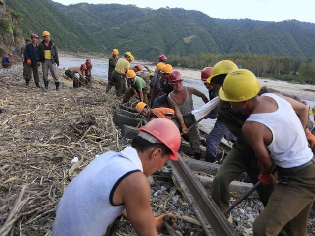 This September 8, 2016 handout photo shows mobilised villagers attempting to repair roads from Chongjing to Musan and Yonsa counties in North Hamyong province. (AFP) This September 8, 2016 handout photo shows mobilised villagers attempting to repair roads from Chongjing to Musan and Yonsa counties in North Hamyong province. (AFP)