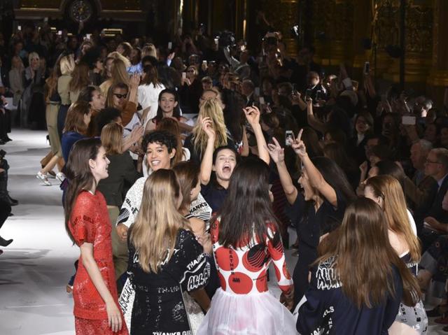 Who said models are expressionless! Look at these happy faces. (AP)