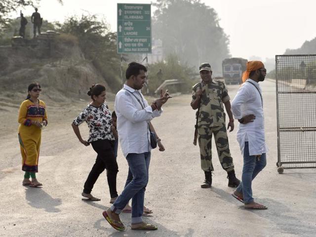 BSF jawans sending back visitors who wanted to watch the evening flag-lowering retreat ceremony at Attari border on Monday.(Gurpreet Singh/T Photo)