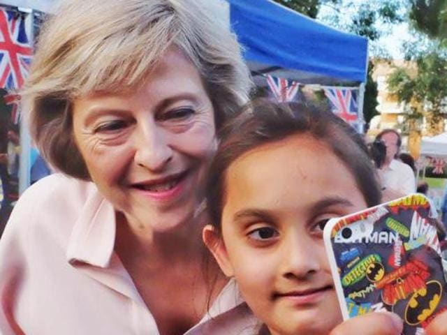 A young fan gets a selfie with the PM Theresa May at the Maidenhead Festival 2016 (Twitter/@ImmigrationatUK) A young fan gets a selfie with the PM Theresa May at the Maidenhead Festival 2016 (Twitter/@ImmigrationatUK)