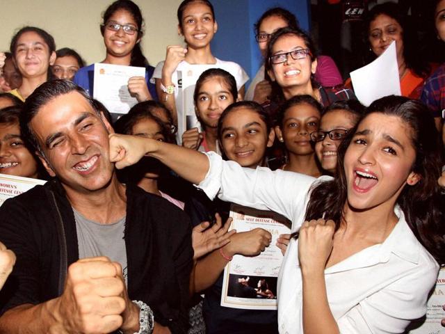 Bollywood actors Akshay Kumar and Alia Bhatt during the graduation day ceremony of women self defense center in Mumbai. (PTI Photo)