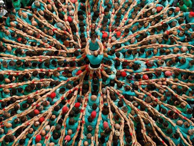 The structure of a human tower varies depending on its complexity. The more complex the tower, the bigger the feat. (Reuters)