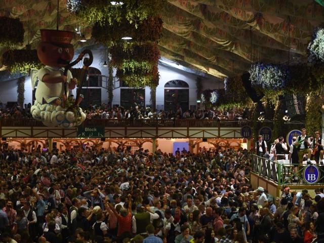 Visitors celebrate inside a festival tent on the final night of the 183th Oktoberfest in Munich. (AFP) 
