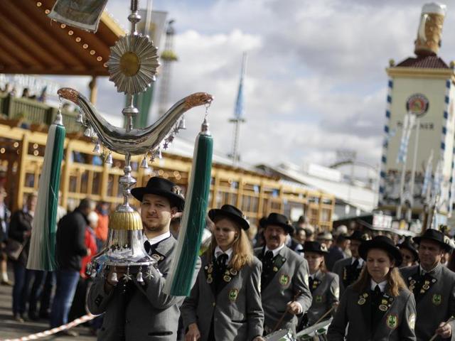Bavarian musicians in traditional costumes arrive at the Bavaria statue on the last day at the 183rd Oktoberfest beer festival in Munich. (AP) 