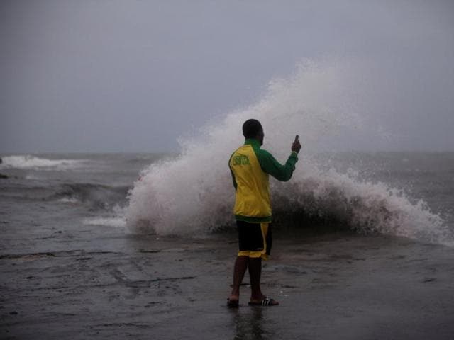 A man takes pictures on an old pier ahead of Hurricane Matthew in Les Cayes, Haiti, October 3. (REUTERS) A man takes pictures on an old pier ahead of Hurricane Matthew in Les Cayes, Haiti, October 3. (REUTERS)