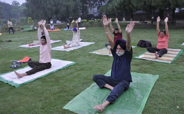 People during a yoga session at Rose Garden in SAS Nagar on Monday. (Keshav Singh/HT Photo) People during a yoga session at Rose Garden in SAS Nagar on Monday. (Keshav Singh/HT Photo)