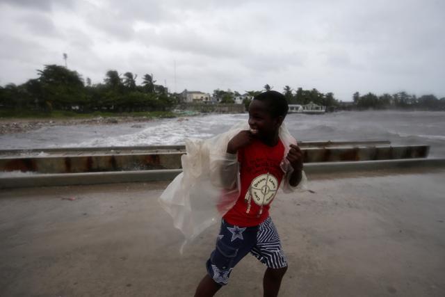 A boy walks along a pier ahead of Hurricane Matthew in Les Cayes, Haiti. (REUTERS) A boy walks along a pier ahead of Hurricane Matthew in Les Cayes, Haiti. (REUTERS)
