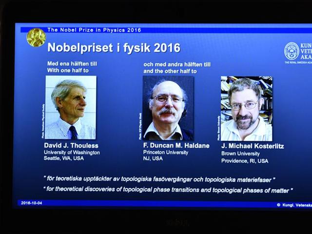 An overhead projector displays the photos of the winners of the Nobel Prize in physics, at the Royal Swedish Academy of Sciences, in Stockholm, Sweden, on Tuesday. (AP) An overhead projector displays the photos of the winners of the Nobel Prize in physics, at the Royal Swedish Academy of Sciences, in Stockholm, Sweden, on Tuesday. (AP)