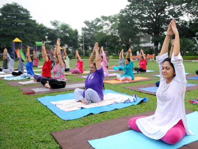 Neighbours bonding over yoga in Sector 12, Panchkula, during a session on Monday.(Anil Dayal/HT Photo)