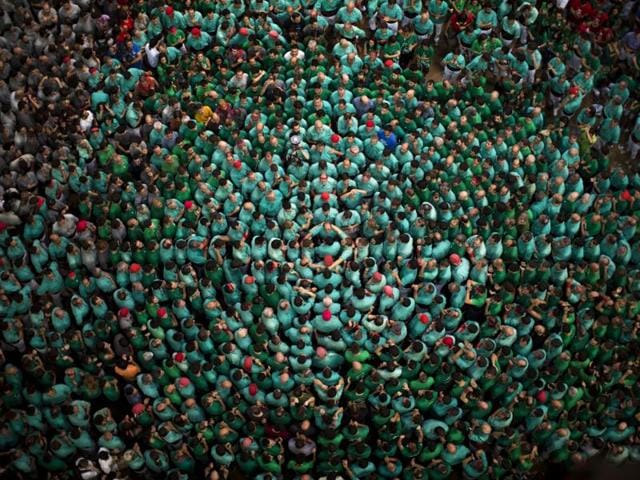 What do you think this is? Yes, it is exactly what you think: A congregation of thousands of people trying to successfully build.....a human tower. (AP)