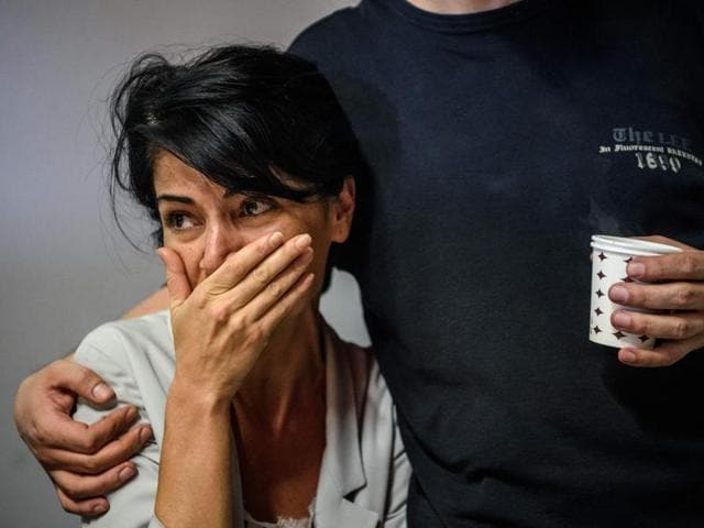 An employee of prominent pro-Kurdish television channel IMC TV cries as Turkish police raid its headquarters in Istanbul on Tuesday. (AFP) An employee of prominent pro-Kurdish television channel IMC TV cries as Turkish police raid its headquarters in Istanbul on Tuesday. (AFP)