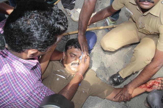A policeman is attended by his colleagues after he was injured in protests in Thudiyalur town in Tamil Nadu following the September 23 murder of Hindu Munnani leader C Sasikumar. (A Joseph)