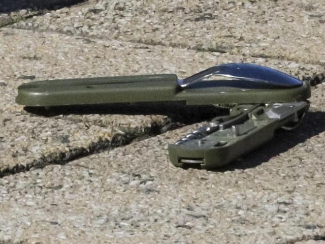 Part of a knife on the ground behind a police cordon as police investigate the scene where a man stabbed two police officers, in the Schaerbeek neighborhood in Brussels, Wednesday. (AP Photo) Part of a knife on the ground behind a police cordon as police investigate the scene where a man stabbed two police officers, in the Schaerbeek neighborhood in Brussels, Wednesday. (AP Photo)