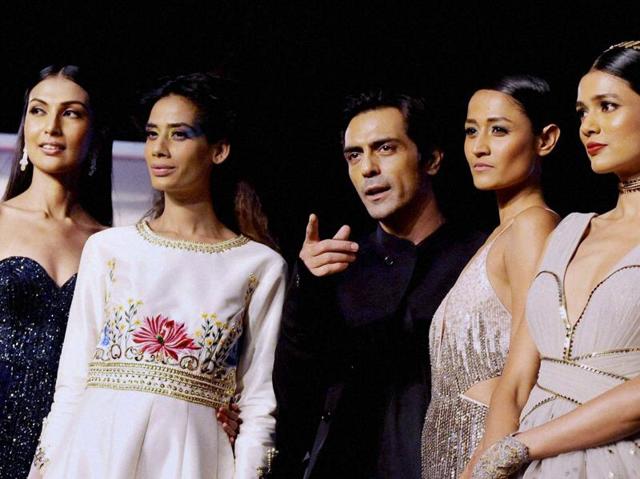 Arjun Rampal with models during the unveiling of Reflections of Style at the preview of Blenders Pride Fashion Tour in Mumbai. (PTI Photo)