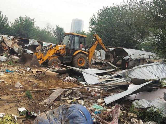 MCG demolished 800 structures built near the stormwater drain and cleared more than eight acres of land during the drive(HT Photo) MCG demolished 800 structures built near the stormwater drain and cleared more than eight acres of land during the drive(HT Photo)
