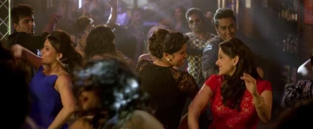 Sai and Priya dancing at a club in the trailer.