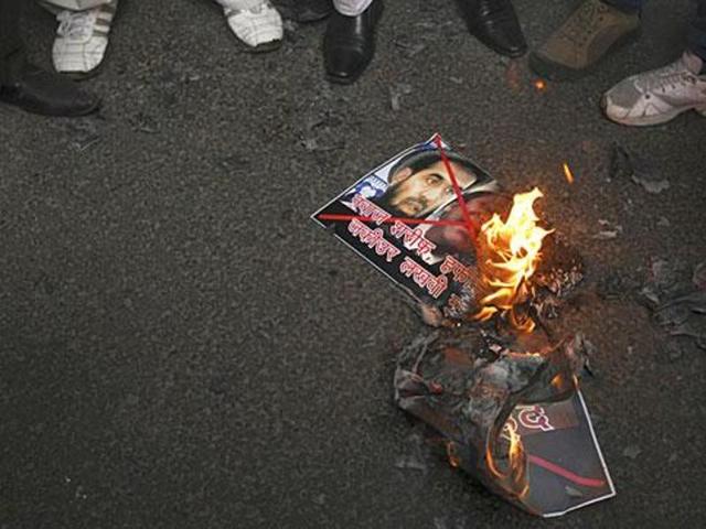 Activists burn posters with the image of LeT operations commander Zaki-ur Rehman Lakhvi, the mastermind of the 2008 Mumbai attacks. (AP file) Activists burn posters with the image of LeT operations commander Zaki-ur Rehman Lakhvi, the mastermind of the 2008 Mumbai attacks. (AP file)