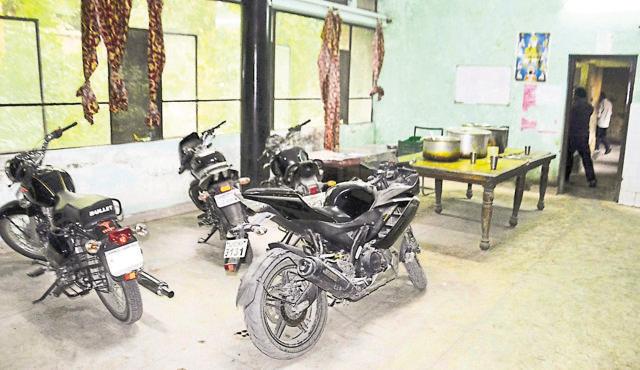 Vehicles parked inside the mess of boys’ hostel block-D. (Sameer Sehgal/HT Photo)