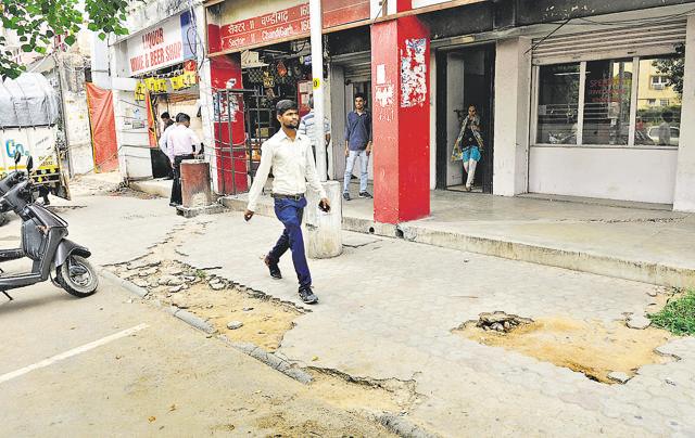 Pavements in need of repair and upkeep in the Sector-11 market. (Ravi Kumar/HT Photo)