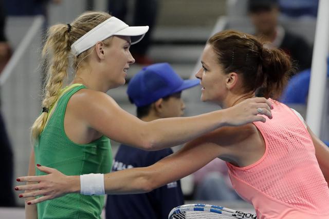 Agnieszka Radwanska, right, hugs Caroline Wozniacki after their match. (AP) Agnieszka Radwanska, right, hugs Caroline Wozniacki after their match. (AP)