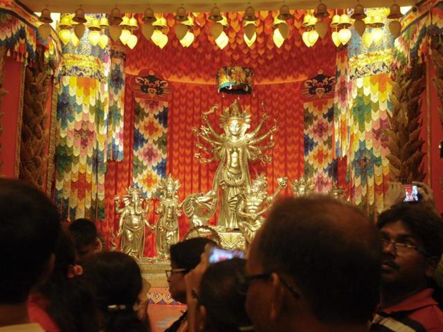 Devotees worship deities and visit pandals to celebrate Durga Puja. (Samir Jana/HT PHOTO) 