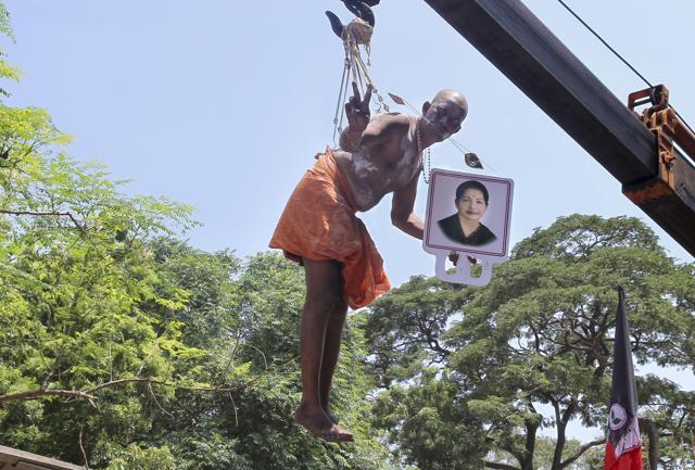 A man, strung by hooks pierced into his back, was suspended from a crane for 45 minutes at Senniamman temple in RK Nagar, Chennai. (V Srinivasulu/HT Photo) A man, strung by hooks pierced into his back, was suspended from a crane for 45 minutes at Senniamman temple in RK Nagar, Chennai. (V Srinivasulu/HT Photo)