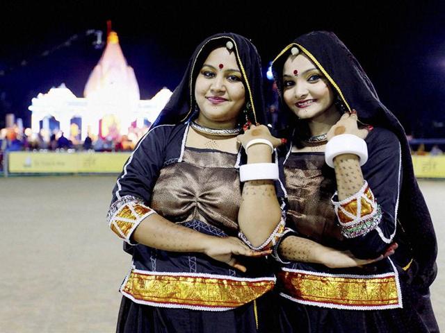 Artists at a Navratri function in Gandhinagar on Tuesday. (PTI) Artists at a Navratri function in Gandhinagar on Tuesday. (PTI)
