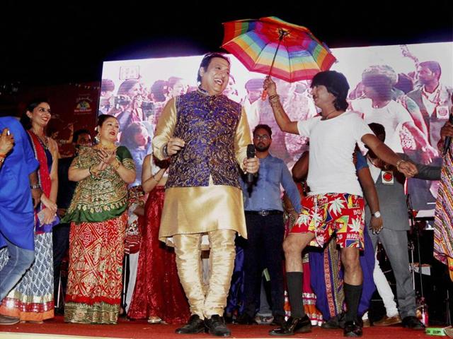 Govinda and his wife at a Garba function on the fourth day of the Navratri festival in Ahmedabad . (PTI Photo)