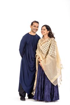 Fashion designer Jattinn Kochhar with his kundalini yoga instructor wife, Gunjan. (On Jattinn: Tunic and pants by Jattinn Kochhar, Uniqlo shoes, and neckpiece from his personal collection On Gunjan: Karuna Khaitan anarkali suit, traditional Jammu jhumkas, diamond wedding ring and Vivienne Westwood sandals) (Reuben Singh)