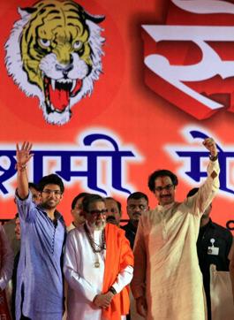 Bal Thackeray flanked by his son Uddhav (right) and grandson Aditya during a Dusshera rally in Mumbai in 2010 (Santosh Hirlekar/PTI) Bal Thackeray flanked by his son Uddhav (right) and grandson Aditya during a Dusshera rally in Mumbai in 2010 (Santosh Hirlekar/PTI)