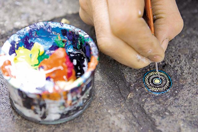 Wilson gets hundreds of requests from locals to paint pictures for them of their chosen subject on chewing gum left on the pavement (UK Press via Getty Images) Wilson gets hundreds of requests from locals to paint pictures for them of their chosen subject on chewing gum left on the pavement (UK Press via Getty Images)