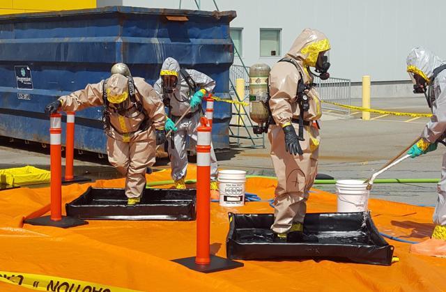 In this June 27, 2016 photo provided by the Royal Canadian Mounted Police, members of the RCMP go through a decontamination procedure in Vancouver after intercepting a package containing approximately 1kg of the powerful opioid carfentanil imported from China. “Cocaine or heroin, we know what the purpose is,” said Allan Lai, an officer-in-charge at the Royal Canadian Mounted Police in Calgary, who is helping oversee the criminal investigation. “With respect to carfentanil, we don’t know why a substance of that potency is coming into our country.” (AP) In this June 27, 2016 photo provided by the Royal Canadian Mounted Police, members of the RCMP go through a decontamination procedure in Vancouver after intercepting a package containing approximately 1kg of the powerful opioid carfentanil imported from China. “Cocaine or heroin, we know what the purpose is,” said Allan Lai, an officer-in-charge at the Royal Canadian Mounted Police in Calgary, who is helping oversee the criminal investigation. “With respect to carfentanil, we don’t know why a substance of that potency is coming into our country.” (AP)