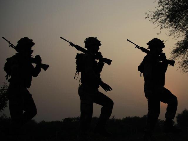 Indian Border Security Force soldiers take up positions at an outpost along a fence at the India-Pakistan border in R.S Pora south-west of Jammu on October 2. (AFP File) Indian Border Security Force soldiers take up positions at an outpost along a fence at the India-Pakistan border in R.S Pora south-west of Jammu on October 2. (AFP File)
