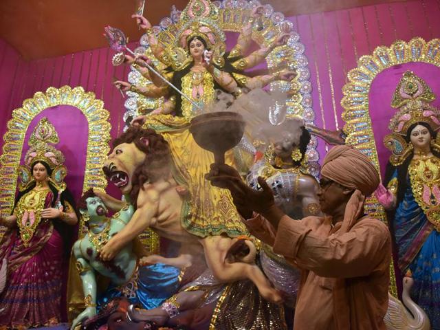 A priest offers prayers to Goddess Durga on October 6, 2016. (AFP) A priest offers prayers to Goddess Durga on October 6, 2016. (AFP)