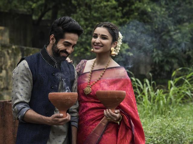 Ayushmann Khurrana and Parineeti Chopra were dressed to perfection for the occasion — Parineeti in a traditional pink and peach sari and Ayushmann in a blue Nehru jacket paired with a grey kurta. (Aalok Soni/HT Photo) Ayushmann Khurrana and Parineeti Chopra were dressed to perfection for the occasion — Parineeti in a traditional pink and peach sari and Ayushmann in a blue Nehru jacket paired with a grey kurta. (Aalok Soni/HT Photo)