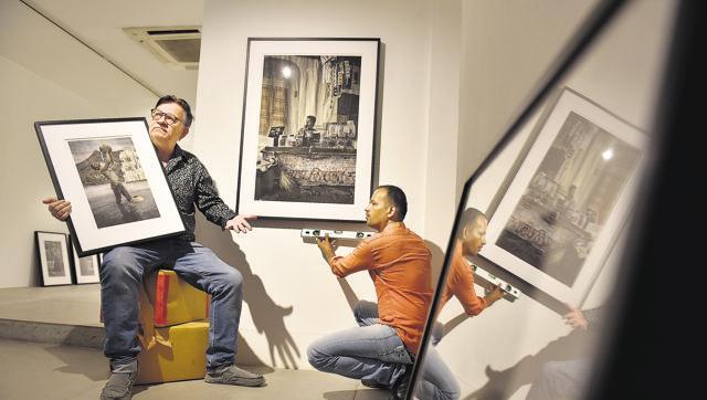 Photographer Waswo X. Waswo and Rajesh Soni, who hand-colours his black and white pictures, setting up their exhibition in a gallery in Lado Sarai.(Sanjeev Verma/HT Photo) Photographer Waswo X. Waswo and Rajesh Soni, who hand-colours his black and white pictures, setting up their exhibition in a gallery in Lado Sarai.(Sanjeev Verma/HT Photo)