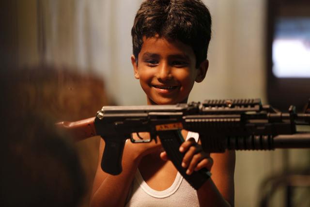 A sill from the movie Dying Dreams, based on how a war-widow prepares her son for a war play. A sill from the movie Dying Dreams, based on how a war-widow prepares her son for a war play.