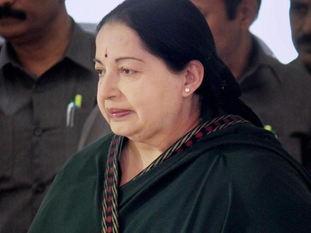 People hold a portrait of Tamil Nadu chief minister J Jayalalithaa as they pray for her well-being as they stand in front of a hospital where she was being treated in Chennai. (AFP File Photo) People hold a portrait of Tamil Nadu chief minister J Jayalalithaa as they pray for her well-being as they stand in front of a hospital where she was being treated in Chennai. (AFP File Photo)